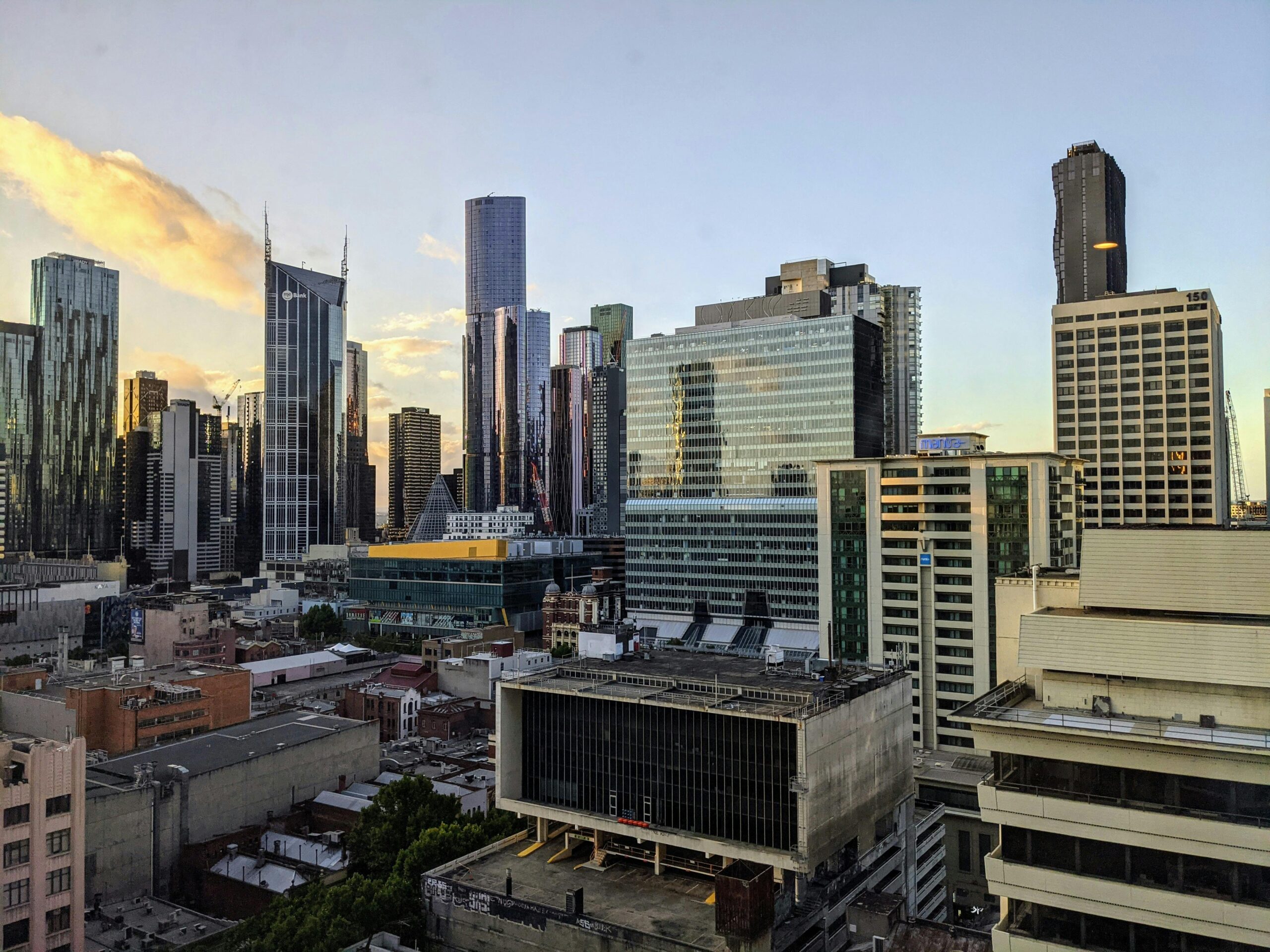 Stunning aerial view of Melbourne's skyline with modern skyscrapers at dusk.